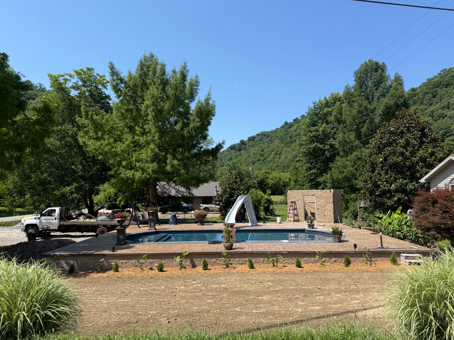 Newly completed pool build with retaining wall